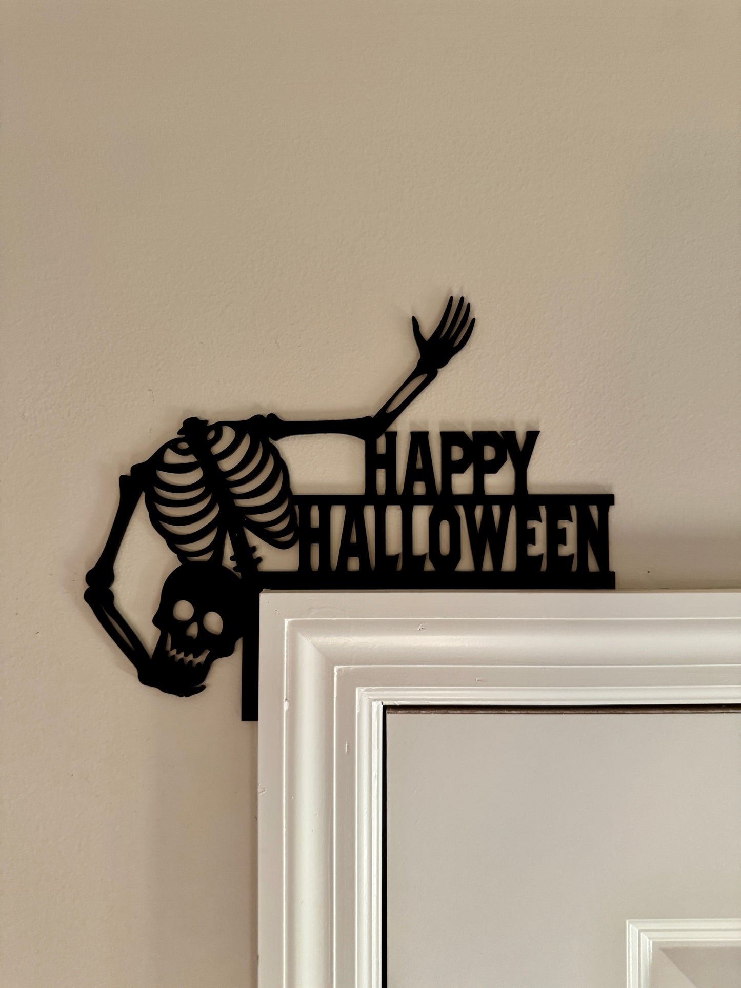 Skeleton holding Head Door Corner made from black acrylic